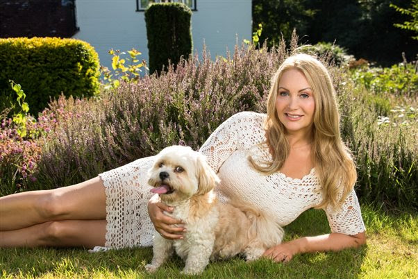 Victoria of K 9 Angel pictured relaxing in the garden with a dog
