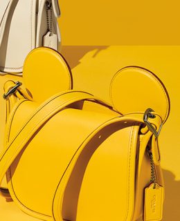 A selection of bags from the Coach Disney Collection