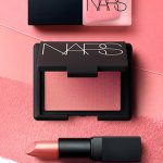 June Beauty Must-Buy: A picture of the new Nars Orgasm collection (featuring lipstick, a blusher & a nail varnish)