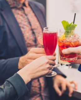 Community Spirit: A group is pictured 'cheersing' with cocktails