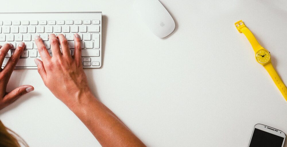 home office, person typing on keyboard