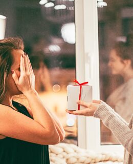 woman giving a gift