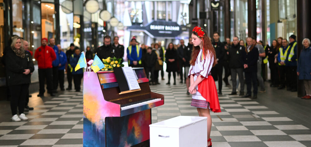 Alisa stands by the piano, Liverpool ONE
