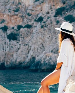 Woman sitting on a rock